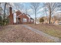 Brick house with a walkway leading to the front entrance at 2000 Shannon Bridge Ln, Matthews, NC 28105