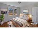 Virtually staged bedroom with wood floors and large windows at 2042 Country Ct, Rock Hill, SC 29732