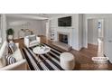 Virtually staged living room with fireplace and hardwood floors at 2042 Country Ct, Rock Hill, SC 29732