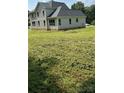 Side view of the house showing large backyard at 6024 Lake Rd, Mint Hill, NC 28227