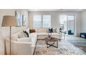 Spacious living room with L-shaped sectional sofa and sliding glass door at 7228 Hodges Meadow Ln, Charlotte, NC 28213