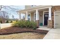 Inviting front porch with stone pillar bases, offering a warm welcome at 117 Tomahawk Dr, Mooresville, NC 28117