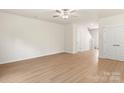 Spacious living room with light wood laminate flooring and ceiling fan at 1514 Doran Ter, Richburg, SC 29729