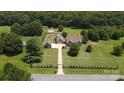 Aerial view showcasing a house, detached garage, and expansive property at 1519 Triplett Rd, Cleveland, NC 27013