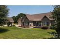 Brick house with front porch and landscaping at 1519 Triplett Rd, Cleveland, NC 27013