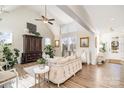 Inviting living room featuring a high ceiling, large windows, and neutral-toned furniture at 1575 Riverwalk Pkwy, Rock Hill, SC 29730