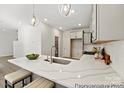 Modern kitchen island with white quartz countertop and gray cabinets at 2101 Morgan Hills Dr # 155P, Albemarle, NC 28001