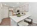 Modern kitchen with gray cabinets, quartz countertops, and island at 2101 Morgan Hills Dr # 155P, Albemarle, NC 28001