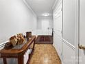 Bright entryway with hardwood floors and decorative table at 2316 Woodfield Cir, Gastonia, NC 28056