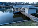 Aerial view of the boat dock featuring multiple boat slips and an area for entertainment at 680 Lake Head Rd, Norwood, NC 28128