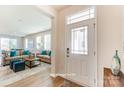 Bright entryway with view of living room and hardwood floors at 7220 Hodges Meadow Ln, Charlotte, NC 28213