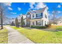 Attractive brick home with landscaping and sidewalk at 9813 Hanberry Blvd, Charlotte, NC 28213