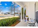 Covered porch with seating and view of the street at 9813 Hanberry Blvd, Charlotte, NC 28213