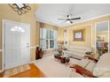 Living room with beige walls, hardwood floor, and comfy seating at 9813 Hanberry Blvd, Charlotte, NC 28213