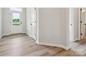 Bright entryway showcasing durable laminate flooring and neutral paint at 10121 Mamillion Dr, Huntersville, NC 28078