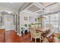 Bright dining room featuring a rustic wooden table and hardwood floors at 138 Byers Commons Dr, Mooresville, NC 28117