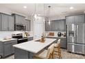 Stylish kitchen with a large center island, stainless steel appliances, and modern lighting at 14041 Whistling Teal Dr, Charlotte, NC 28262