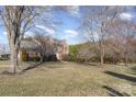 Two-story home with a well-manicured lawn and mature trees in a residential neighborhood at 2102 Sipe Rd, Conover, NC 28613