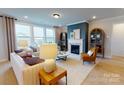 Spacious living room with a fireplace and comfortable seating at 213 English Arbor Dr # 10, Fort Mill, SC 29715