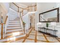 Elegant two-story entryway, showcasing a grand staircase at 2510 Tulip Hill Dr, Charlotte, NC 28270