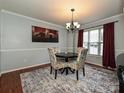 Dining room with dark wood table, patterned chairs, and a chandelier at 364 Holstein Dr, Dallas, NC 28034