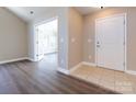 Bright entryway with hardwood floors and access to sunroom at 4723 Polo Gate Blvd, Charlotte, NC 28216