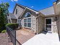 Front entrance with stone facade and brick walkway at 4723 Polo Gate Blvd, Charlotte, NC 28216