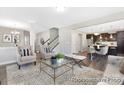 Spacious living room with comfortable seating and open floor plan at 5011 Mooreland Oaks Way # 3P, Mount Holly, NC 28120