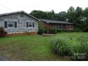 Ranch home with a separate shed and landscaping at 5590 S Nc 16 Business Hwy, Maiden, NC 28650