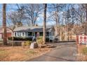 Gray house with red door and driveway at 604 Beaten Path Rd, Mooresville, NC 28117