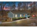 Gray house with a porch and landscaping at 604 Beaten Path Rd, Mooresville, NC 28117