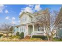 Inviting two-story home featuring a charming front porch and a well-maintained landscape at 746 Waterscape Ct, Rock Hill, SC 29730