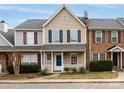 Charming two-story townhome with neutral siding and contrasting shutters at 8272 Golf Ridge Dr, Charlotte, NC 28277