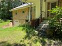 Brick house showcasing side entrance and stairs at 8725 Bringle Ferry Rd, Salisbury, NC 28146