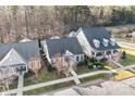 An aerial shot showcasing the home's roof and landscaping in a desirable neighborhood with mature trees at 11508 Dublin Crescent Rd, Cornelius, NC 28031