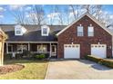 Brick front exterior of charming townhome with 2-car garage at 121 Quality Dr, Mount Holly, NC 28120