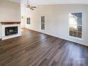 Bright living room with hardwood floors and large windows at 13943 Dannemara Dr, Pineville, NC 28134