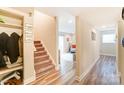 Light and bright entryway with stairs and coat closet at 1605 Merry Oaks Rd # E, Charlotte, NC 28205