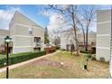 View of community courtyard and beautiful landscaping from upper level at 1605 Merry Oaks Rd # E, Charlotte, NC 28205