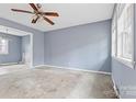 Spacious living room with light blue walls and carpet at 2209 Donnabrook Ln, Gastonia, NC 28052