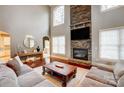 Two-story Gathering room with stone fireplace and hardwood floors at 252 Bay Shore Loop, Mooresville, NC 28117