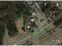 Aerial view showing house, pool, and large lot at 2948 W Main St, Claremont, NC 28610