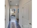 Open entryway with wood-look floors and coat closet at 3021 Belstock Ct, Charlotte, NC 28216