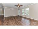 Bright living room with hardwood floors, white trim, and double windows offering natural light at 3035 Agean Ln, York, SC 29745