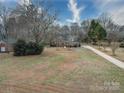 Property's aerial view showing house, yard, and driveway at 3119 Drake Ln, Monroe, NC 28110