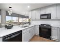 Modern kitchen featuring white cabinets, quartz countertops, stainless steel appliances, and backsplash at 315 Arlington Ave # 604, Charlotte, NC 28203