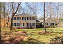 Classic two-story home with black shutters and a manicured front yard in a quiet, wooded setting at 3153 Wimbledon Ln, Rock Hill, SC 29732