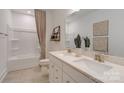 Bathroom with double vanity, shower/tub combo, and modern finishes at 3527 Rapport Ct # 025, Lancaster, SC 29720