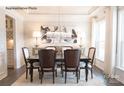 Formal dining room with crystal chandelier and dark wood furniture at 3539 Rapport Ct # 022, Lancaster, SC 29720