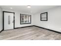 Bright living room with gray floors and black trim at 412 N Vance St, Gastonia, NC 28052